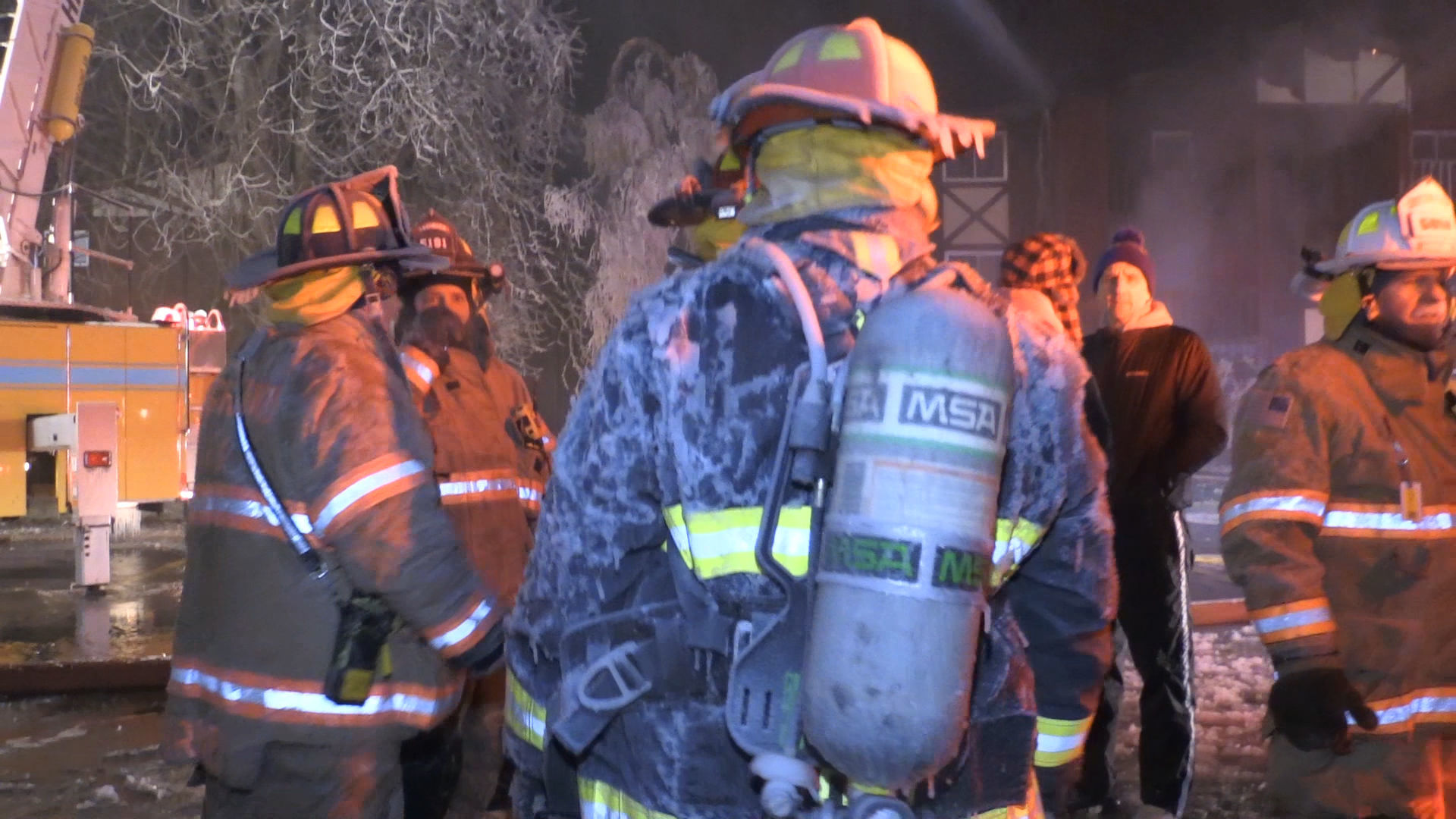 Firefighters continue to battle apartment building fire